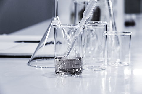 three-clear-beakers-placed-on-tabletop-thumbnail.jpg